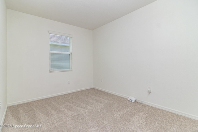 122 Port Royal Cir, Sebastian, FL 32958 - carpeted empty room with baseboards