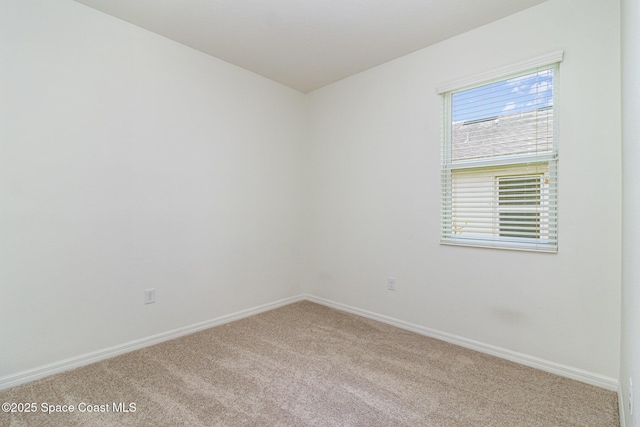 122 Port Royal Cir, Sebastian, FL 32958 - spare room featuring carpet flooring and baseboards