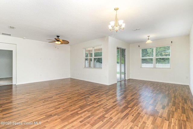 122 Port Royal Cir, Sebastian, FL 32958 - empty room featuring wood finished floors, a chandelier, a ceiling fan, and baseboards