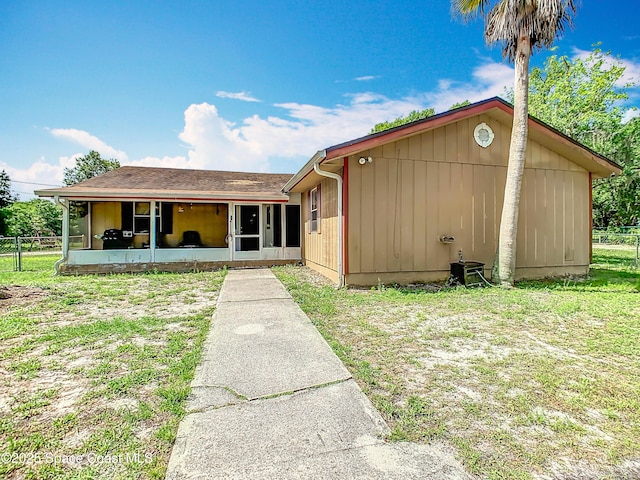 4432 Freedom Rd, Kissimmee, FL 34746 - view of front facade with a sunroom