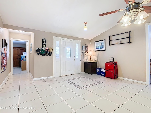 4432 Freedom Rd, Kissimmee, FL 34746 - entryway featuring ceiling fan, lofted ceiling, baseboards, and light tile patterned flooring