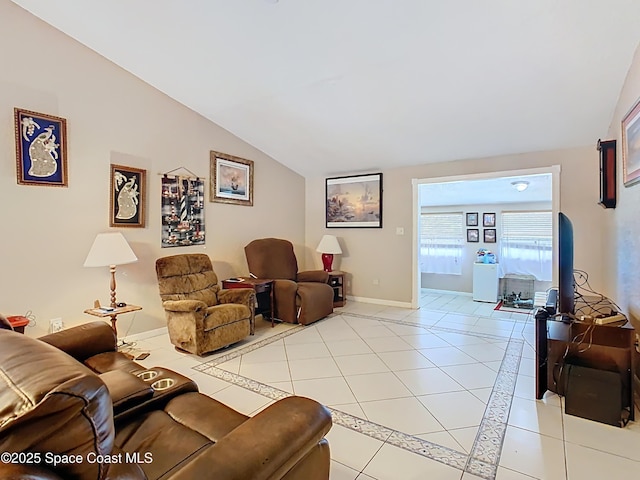 4432 Freedom Rd, Kissimmee, FL 34746 - living room featuring lofted ceiling, light tile patterned flooring, and baseboards