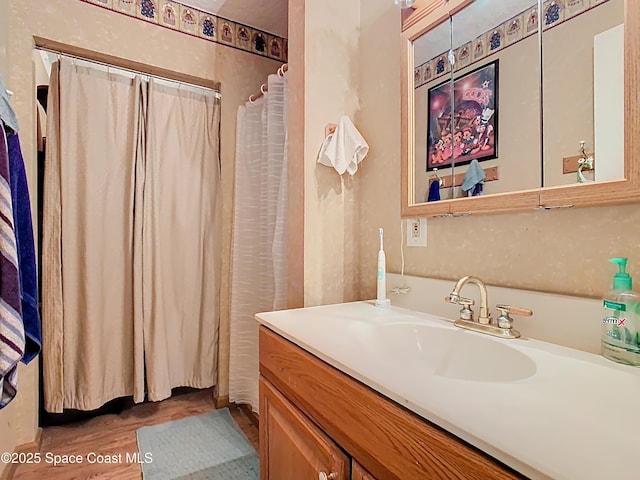 4432 Freedom Rd, Kissimmee, FL 34746 - full bath featuring vanity and wood finished floors