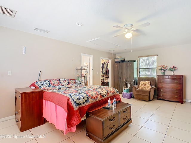 4432 Freedom Rd, Kissimmee, FL 34746 - bedroom with a spacious closet, light tile patterned floors, and ceiling fan