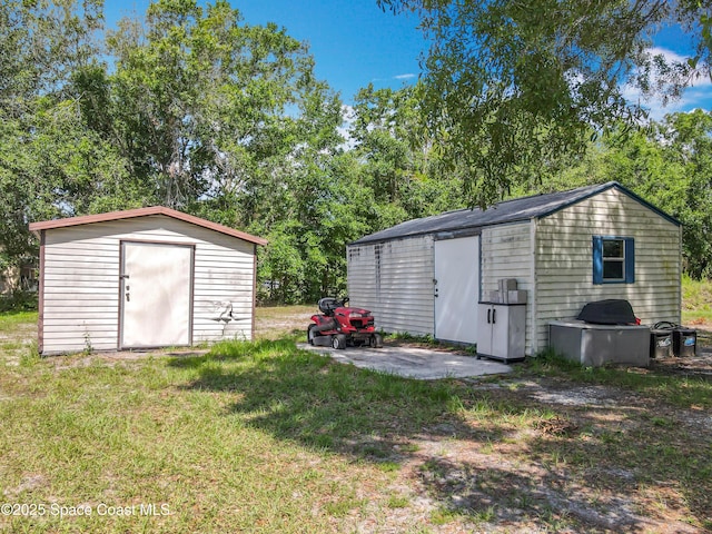 4432 Freedom Rd, Kissimmee, FL 34746 - view of shed featuring view of wooded area