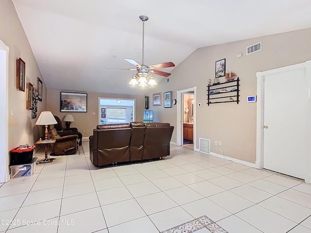 4432 Freedom Rd, Kissimmee, FL 34746 - living area with vaulted ceiling, ceiling fan, light tile patterned flooring, and baseboards