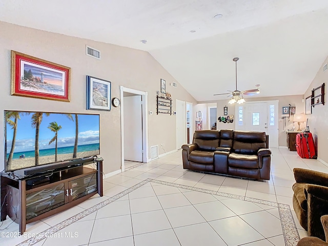 4432 Freedom Rd, Kissimmee, FL 34746 - living room featuring vaulted ceiling, light tile patterned flooring, a ceiling fan, and baseboards