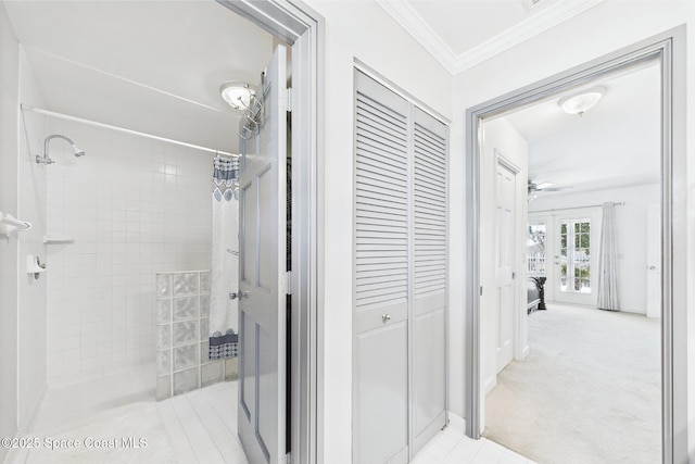 2945 70th Pl, Vero Beach, FL 32967 - full bathroom featuring tiled shower, ornamental molding, french doors, a ceiling fan, and baseboards