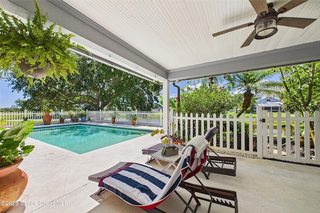 2945 70th Pl, Vero Beach, FL 32967 - view of swimming pool with ceiling fan, a fenced backyard, and a patio