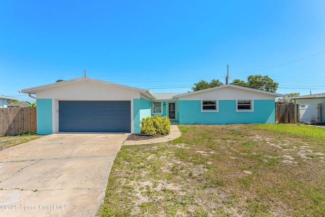 1310 Holt Dr, Merritt Island, FL 32952 - single story home with concrete driveway, a garage, and stucco siding