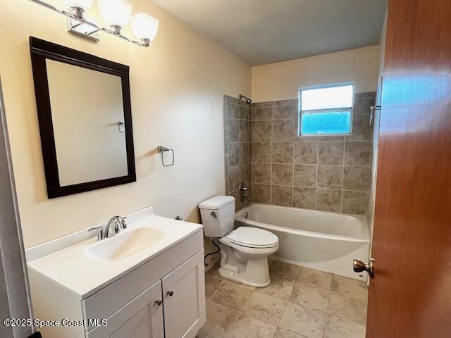bathroom with vanity, toilet, and bathing tub / shower combination