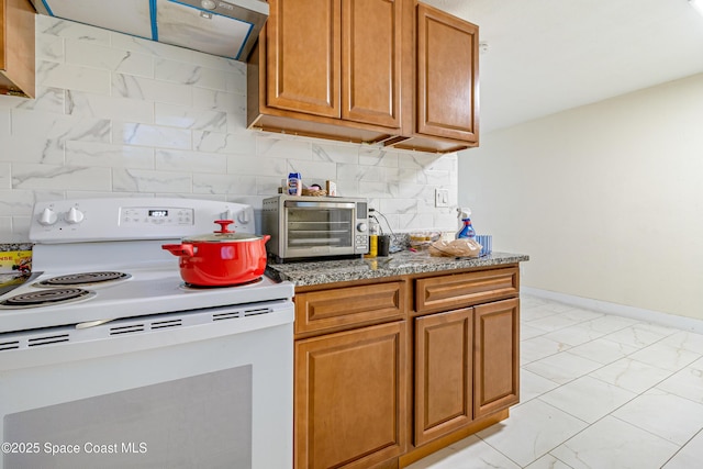 1049 Azalea Ln, Cocoa, FL 32922 - kitchen with white electric range oven, light marble finish flooring, brown cabinetry, tasteful backsplash, and baseboards