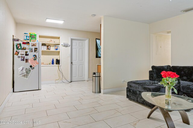 1049 Azalea Ln, Cocoa, FL 32922 - sitting room with baseboards