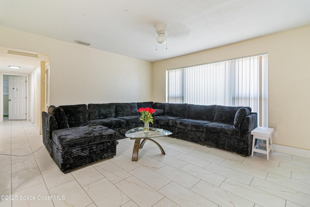 1049 Azalea Ln, Cocoa, FL 32922 - living area with a ceiling fan and light tile patterned floors