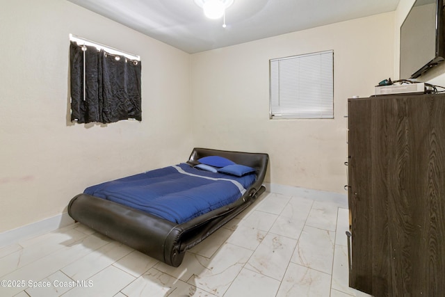 1049 Azalea Ln, Cocoa, FL 32922 - bedroom featuring light marble finish flooring and baseboards