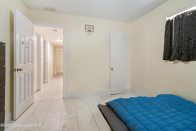 1049 Azalea Ln, Cocoa, FL 32922 - bedroom with light marble finish flooring and baseboards