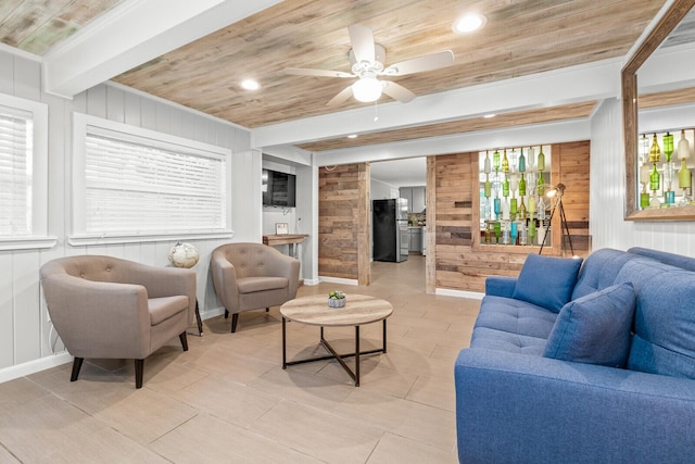 living room with wood ceiling, wood walls, recessed lighting, a ceiling fan, and baseboards