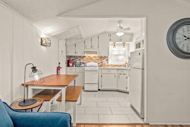 kitchen with white appliances, light countertops, crown molding, a ceiling fan, and a textured ceiling