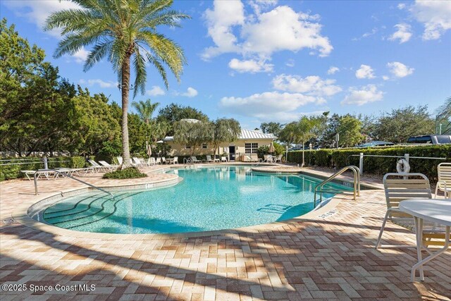 480 Sail Ln Unit 607, Merritt Island, FL 32953 - community pool with a patio area and fence