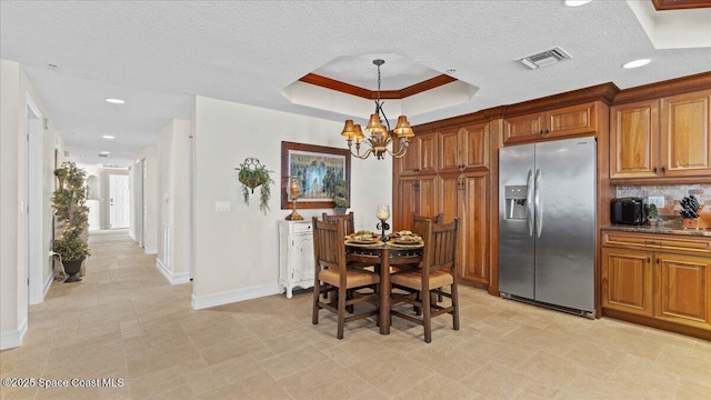 480 Sail Ln Unit 607, Merritt Island, FL 32953 - dining space with a tray ceiling, baseboards, a chandelier, and recessed lighting