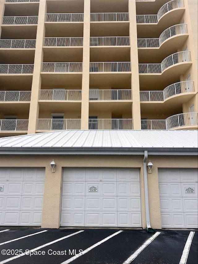 480 Sail Ln Unit 607, Merritt Island, FL 32953 - view of building exterior with community garages