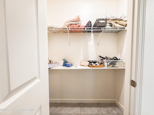 1491 Higbee St SE, Palm Bay, FL 32909 - walk in closet with light tile patterned floors