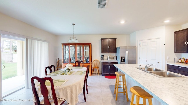 1491 Higbee St SE, Palm Bay, FL 32909 - dining space with light tile patterned flooring and recessed lighting