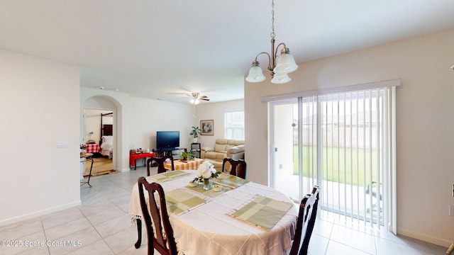 1491 Higbee St SE, Palm Bay, FL 32909 - dining space with arched walkways, light tile patterned floors, baseboards, and a chandelier