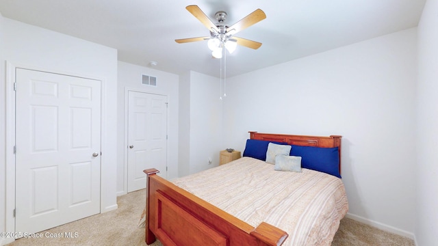 1491 Higbee St SE, Palm Bay, FL 32909 - bedroom with light colored carpet, baseboards, and ceiling fan