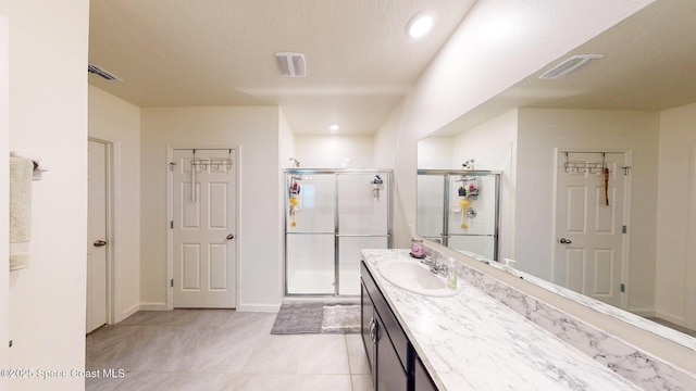 1491 Higbee St SE, Palm Bay, FL 32909 - bathroom featuring a shower stall, vanity, tile patterned floors, baseboards, and recessed lighting