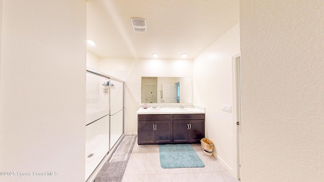 1491 Higbee St SE, Palm Bay, FL 32909 - bathroom with a shower stall, double vanity, tile patterned floors, and baseboards