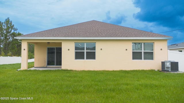 1491 Higbee St SE, Palm Bay, FL 32909 - back of property featuring central AC, a shingled roof, and stucco siding