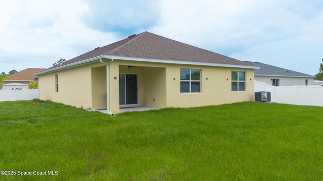 1491 Higbee St SE, Palm Bay, FL 32909 - back of property featuring stucco siding, central AC unit, and roof with shingles