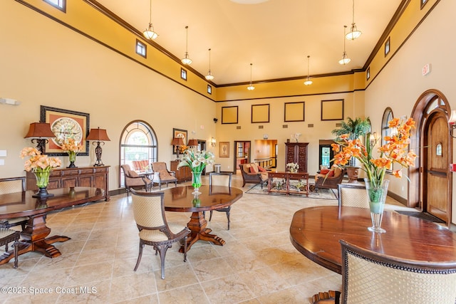 common area with a high ceiling and crown molding