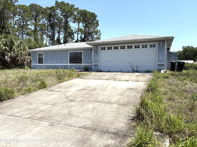 view of front facade with driveway and an attached garage