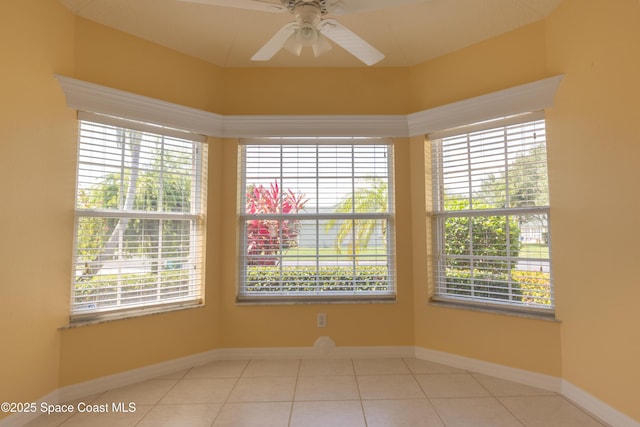 911 Indian Oaks Dr, Melbourne, FL 32901 - unfurnished room featuring a ceiling fan, healthy amount of natural light, baseboards, and tile patterned floors