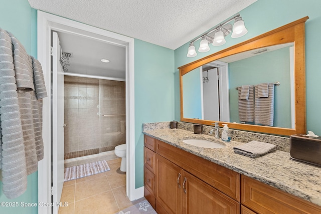 300 Columbia Dr Unit 108-2, Cape Canaveral, FL 32920 - bathroom featuring a shower stall, tile patterned floors, toilet, vanity, and a textured ceiling