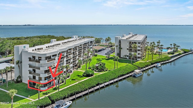 300 Columbia Dr Unit 108-2, Cape Canaveral, FL 32920 - drone / aerial view of apartment complex and a nearby body of water