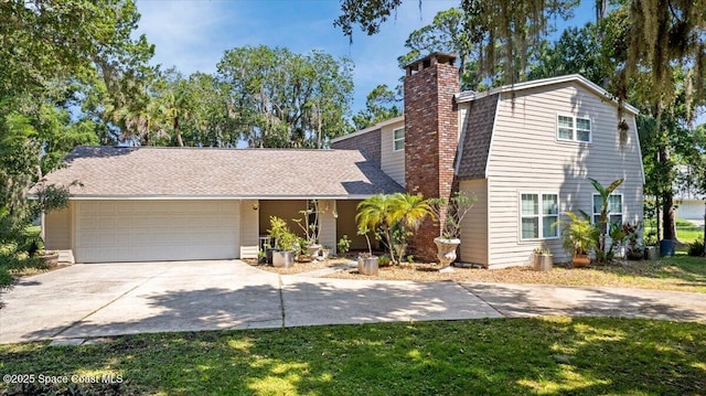 965 Bluegrass Ln, Rockledge, FL 32955 - view of front of property with a garage, a chimney, concrete driveway, and a front yard