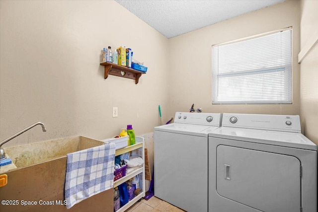 965 Bluegrass Ln, Rockledge, FL 32955 - washroom featuring washing machine and clothes dryer and a textured ceiling