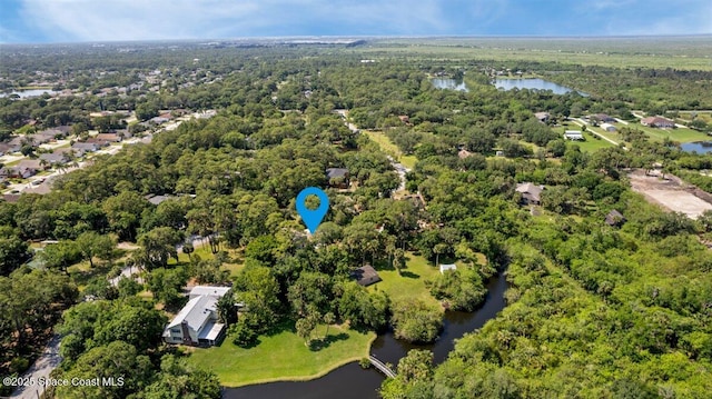 965 Bluegrass Ln, Rockledge, FL 32955 - drone / aerial view of a nearby body of water and a forest
