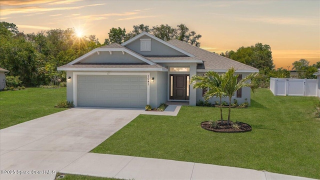 1041 Tupelo Cir, Cocoa, FL 32926 - view of front of home with an attached garage, stucco siding, driveway, and a shingled roof