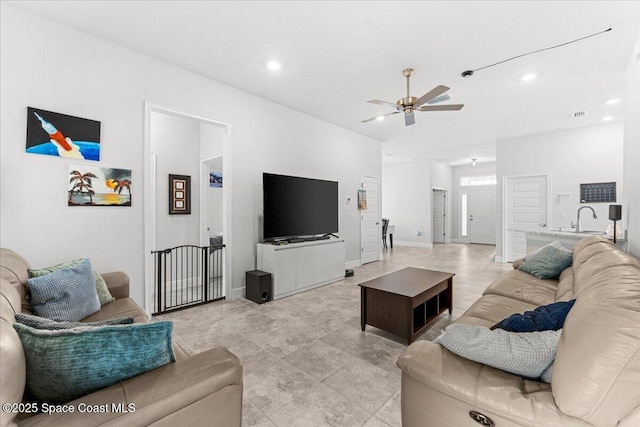 1041 Tupelo Cir, Cocoa, FL 32926 - living area with ceiling fan, recessed lighting, light tile patterned floors, and baseboards