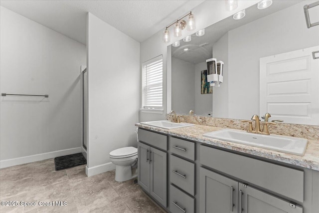 1041 Tupelo Cir, Cocoa, FL 32926 - full bath featuring toilet, double vanity, a shower stall, baseboards, and a textured ceiling