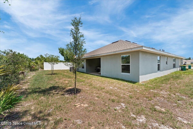 1041 Tupelo Cir, Cocoa, FL 32926 - back of house featuring stucco siding