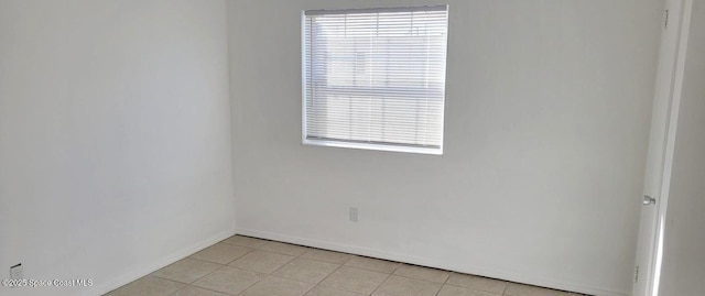 55 Needle Blvd Unit 76, Merritt Island, FL 32953 - unfurnished room with baseboards and light tile patterned floors