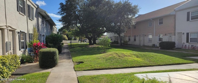 55 Needle Blvd Unit 76, Merritt Island, FL 32953 - view of community with a yard and a residential view