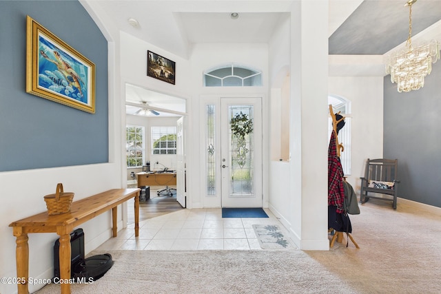 1737 Windbrook Dr SE, Palm Bay, FL 32909 - foyer entrance featuring a chandelier, tile patterned floors, a high ceiling, and baseboards