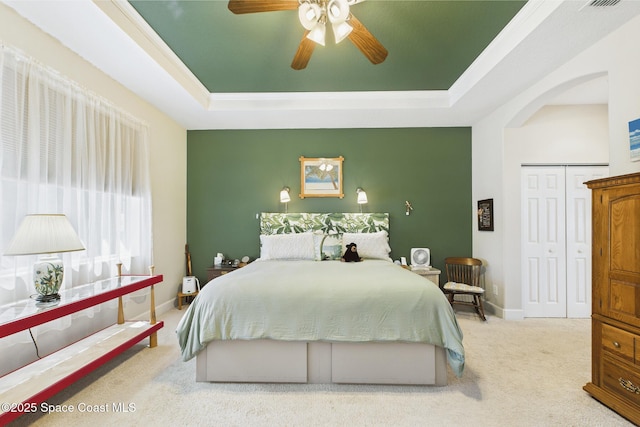 1737 Windbrook Dr SE, Palm Bay, FL 32909 - bedroom with a tray ceiling, carpet flooring, ceiling fan, and baseboards