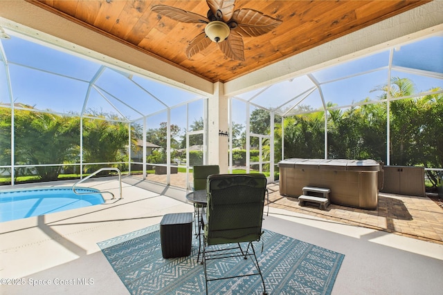 1737 Windbrook Dr SE, Palm Bay, FL 32909 - view of patio featuring a hot tub, glass enclosure, a ceiling fan, and an outdoor pool
